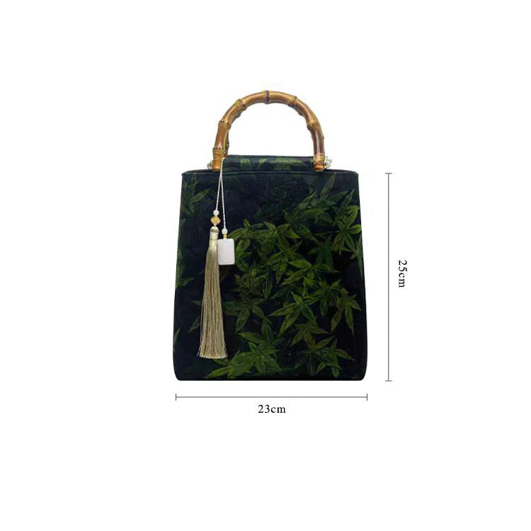 Brown letter pattern bamboo pattern handle bucket bag