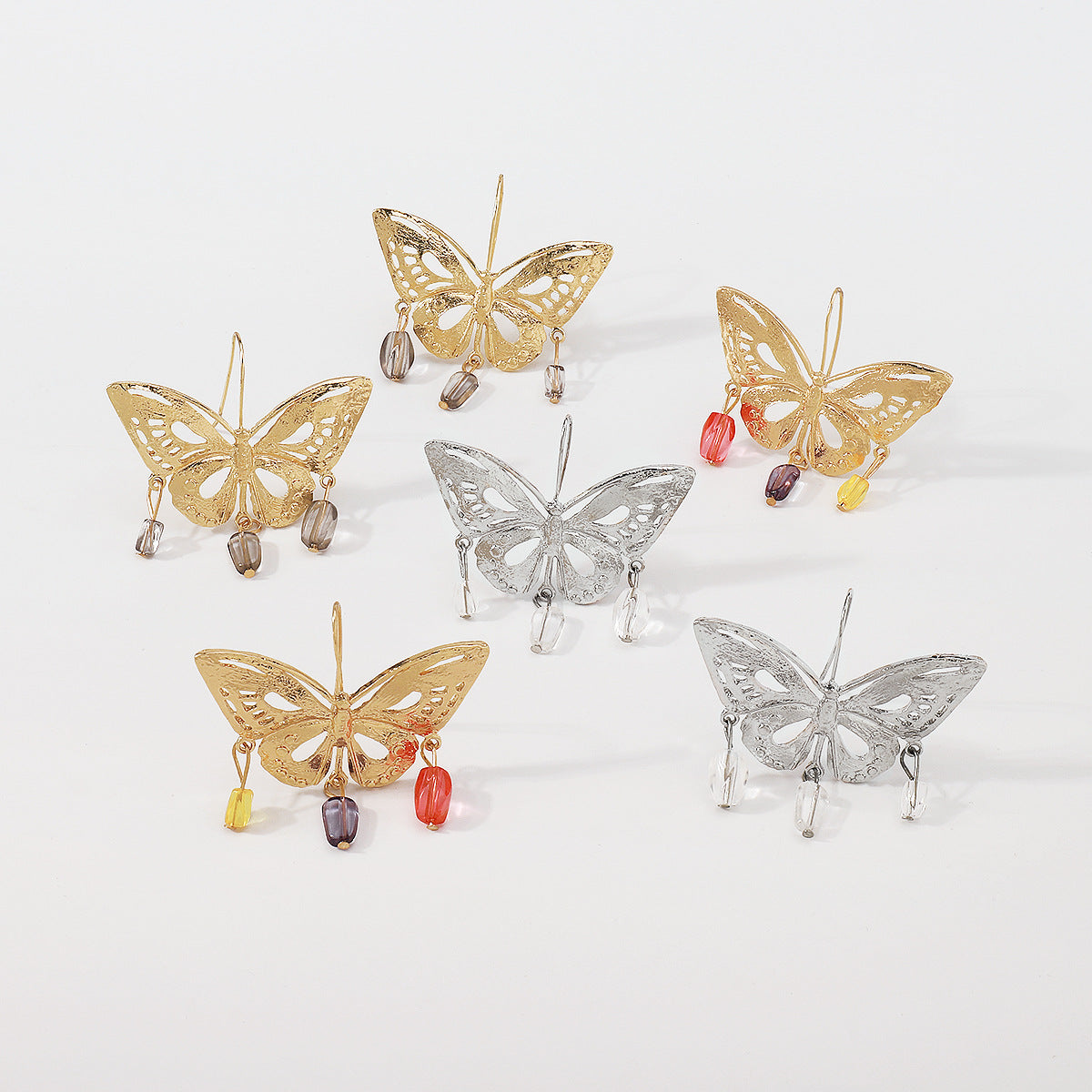 golden hollow butterfly pendant earrings