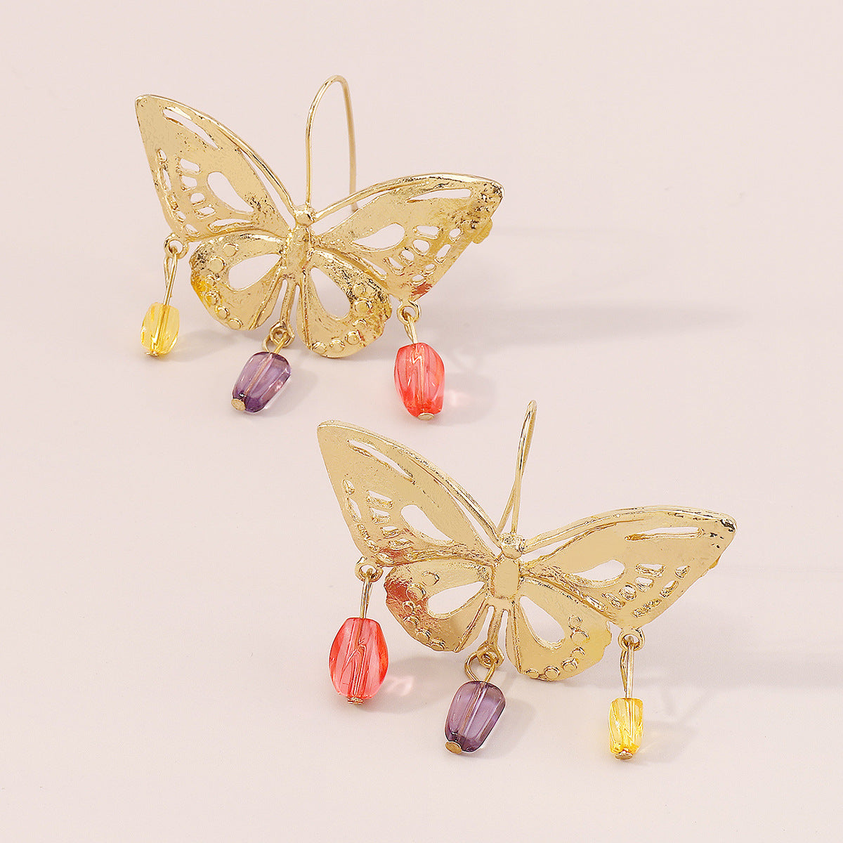 golden hollow butterfly pendant earrings