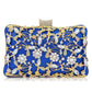 Floral party clutch bag decorated with silver and golden rhinestones