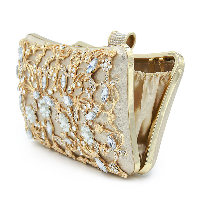 Floral party clutch bag decorated with silver and golden rhinestones