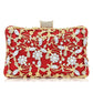 Floral party clutch bag decorated with silver and golden rhinestones