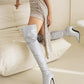 Over-the-knee boots with pointed toe stiletto heels and silver glitter