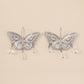 Silver hollow-out butterfly pendant earrings