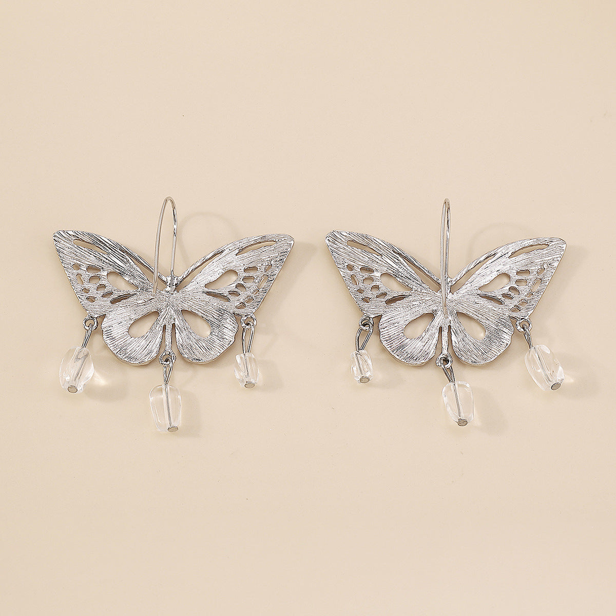 Silver hollow-out butterfly pendant earrings