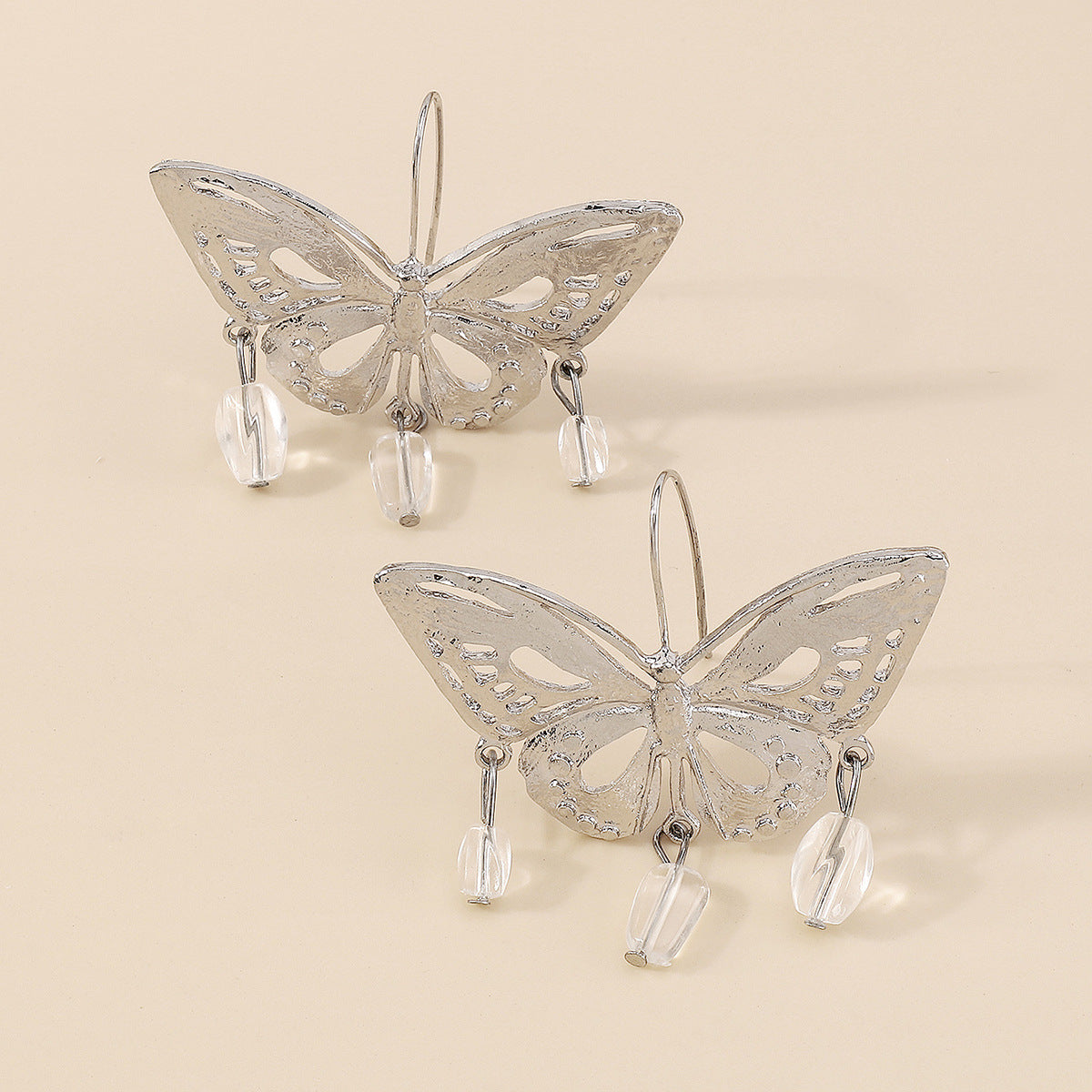 Silver hollow-out butterfly pendant earrings