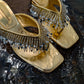 <tc>Gold Breezy Tassel Sandals</tc>