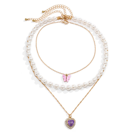 Pink butterfly and purple heart Y2K pearl and chain multilayer necklace