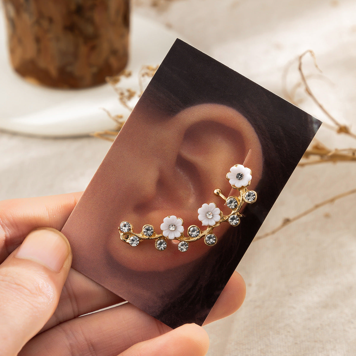 golden rhinestone flower ear studs